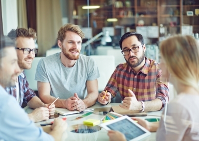 Group of young professionals meeting at table